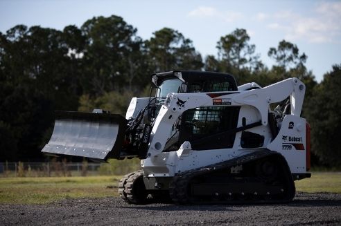 Why a Skid Steer Dozer Blade Is a Must-Have Attachment