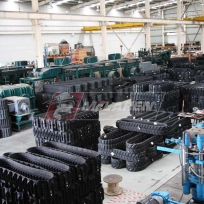Rubber Tracks Manufacturing Facility - staging of harvester rubber tracks for Kubota Harvesters